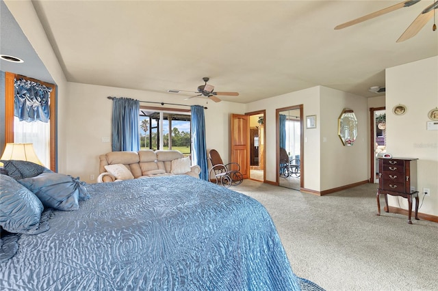 carpeted bedroom featuring access to outside and ceiling fan