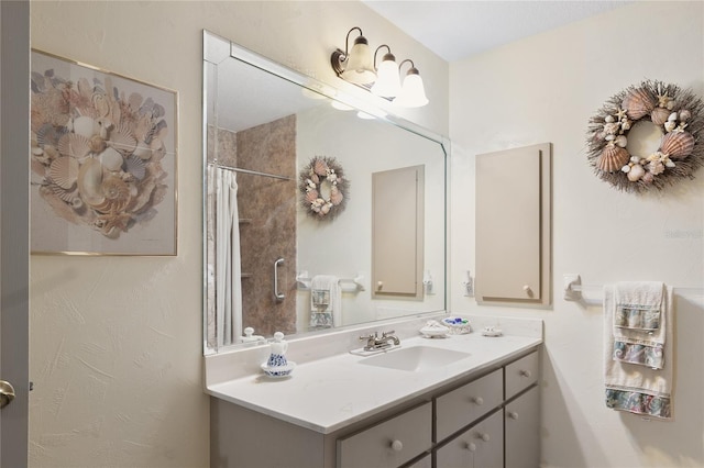 bathroom with vanity and curtained shower