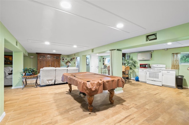 recreation room with pool table and light hardwood / wood-style flooring