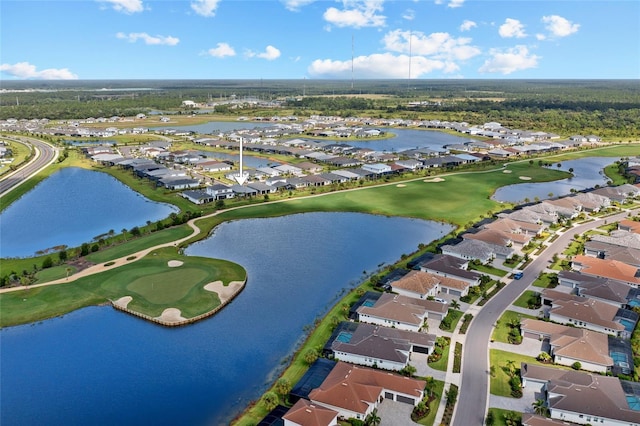 aerial view featuring a residential view, a water view, and golf course view