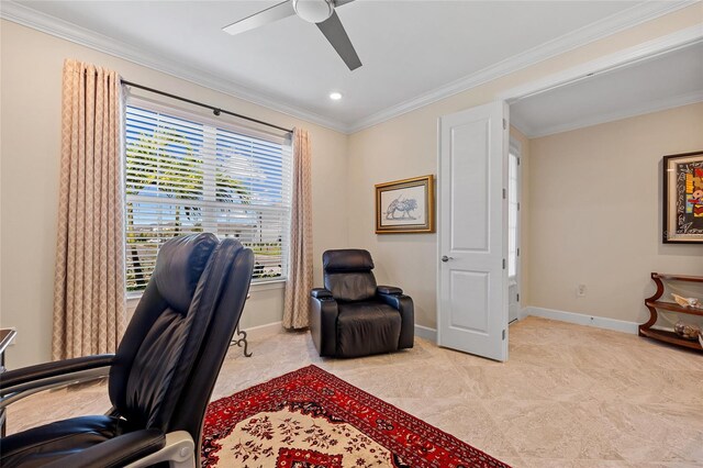 carpeted office featuring crown molding and ceiling fan