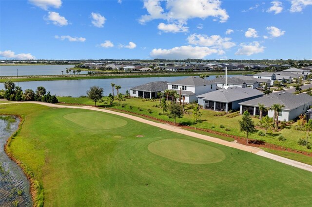 exterior space with a yard and a water view