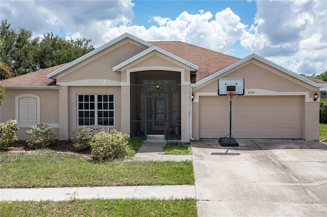 ranch-style home featuring an attached garage, roof with shingles, concrete driveway, and stucco siding