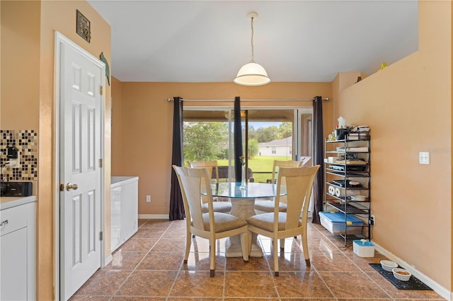 dining area featuring baseboards