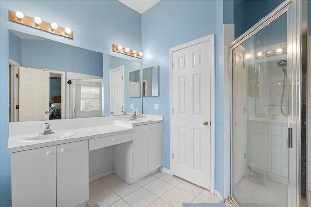 ensuite bathroom with ensuite bath, a stall shower, and a sink