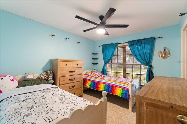 carpeted bedroom featuring ceiling fan