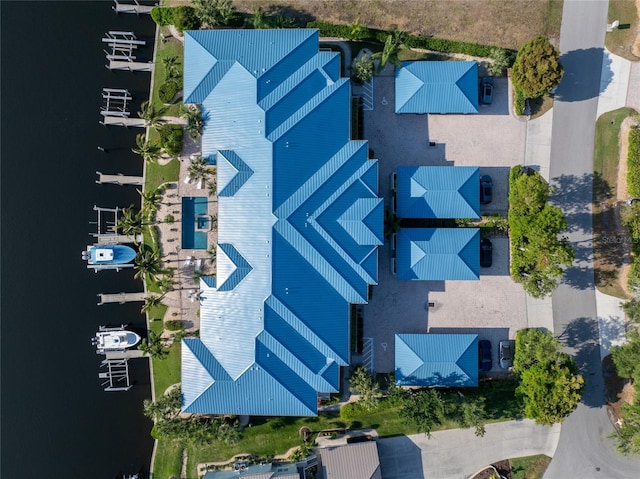 birds eye view of property with a water view