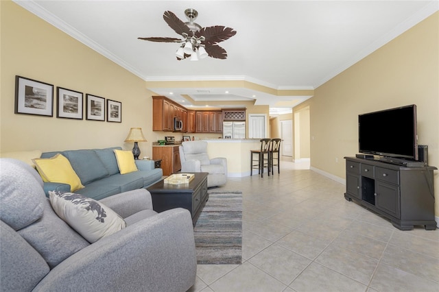 living room featuring crown molding, ceiling fan, and light tile patterned flooring