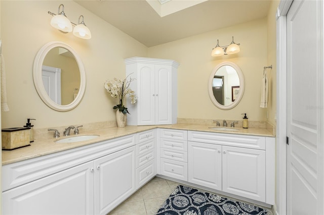 bathroom with tile patterned flooring and vanity