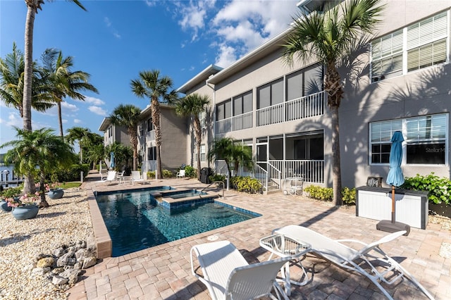 view of swimming pool with a patio