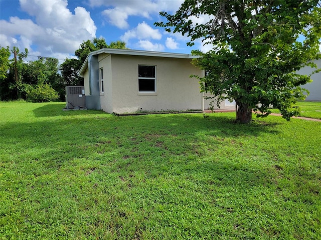 view of side of home featuring a yard