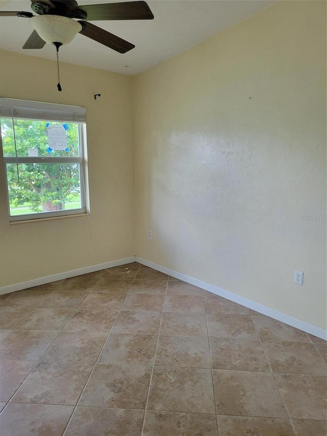 spare room featuring ceiling fan