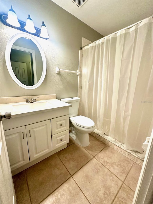 full bath with vanity, tile patterned floors, toilet, and a shower with shower curtain