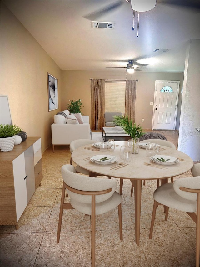 dining room featuring a ceiling fan and visible vents