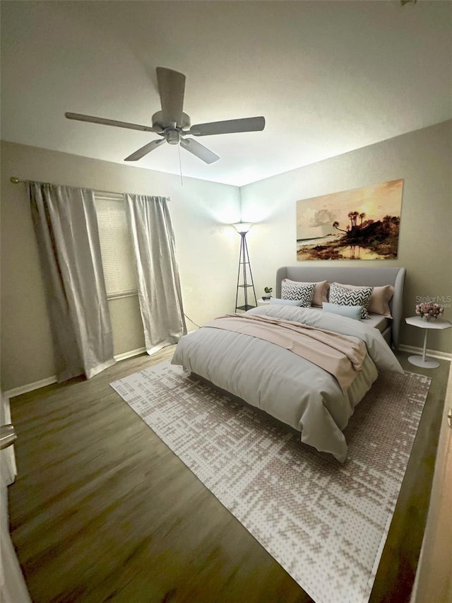 bedroom featuring hardwood / wood-style floors and ceiling fan