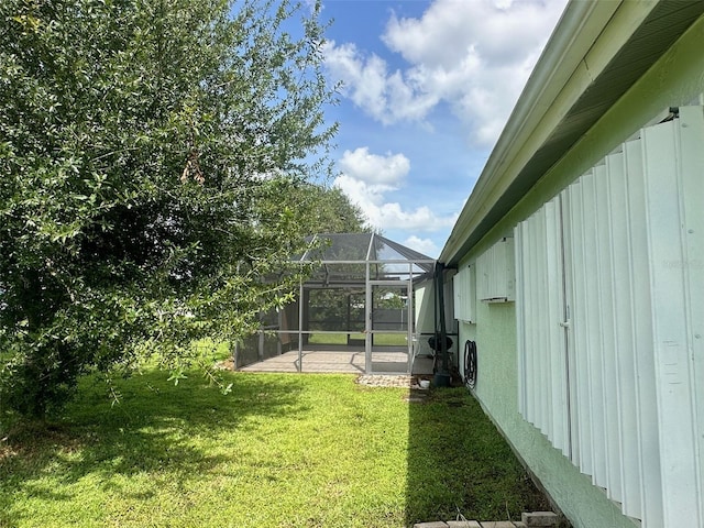 view of yard featuring glass enclosure