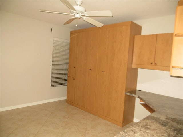 601 Shreve St Unit 12B, Punta Gorda, FL 33950 - kitchen featuring a ceiling fan and light tile patterned flooring