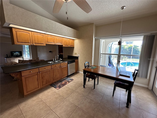 kitchen with hanging light fixtures, dishwasher, sink, lofted ceiling, and ceiling fan