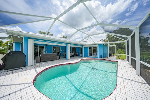 view of swimming pool with a lanai, area for grilling, outdoor lounge area, and a patio