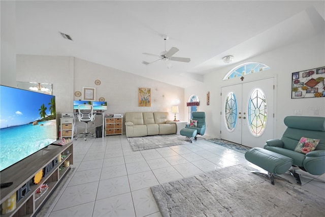 living room with french doors, ceiling fan, light tile patterned floors, and vaulted ceiling