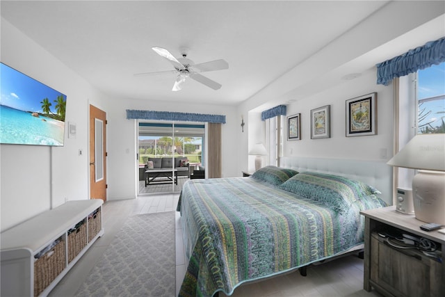 bedroom featuring ceiling fan, hardwood / wood-style flooring, and access to outside