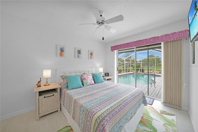 bedroom featuring ceiling fan, access to outside, a sunroom, and baseboards