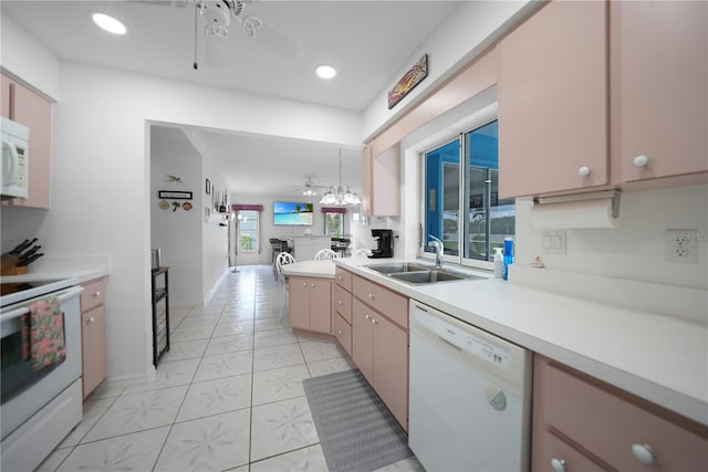 kitchen with recessed lighting, light countertops, a sink, ceiling fan, and white appliances