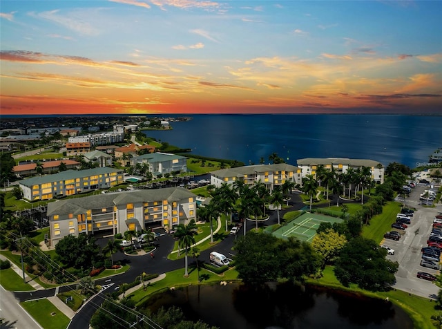 aerial view at dusk with a water view