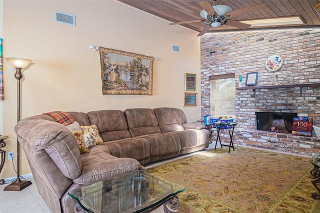 living room with light tile patterned floors, a brick fireplace, ceiling fan, wood ceiling, and lofted ceiling