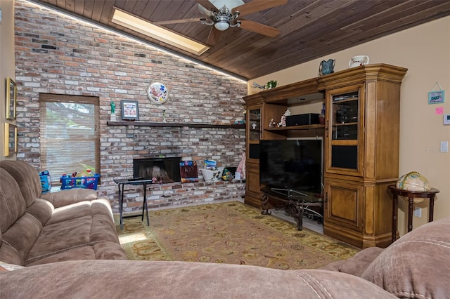 living area with a ceiling fan, lofted ceiling, wood ceiling, brick wall, and a brick fireplace