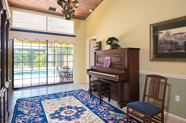 sitting room with visible vents, vaulted ceiling, tile patterned flooring, wooden ceiling, and baseboards