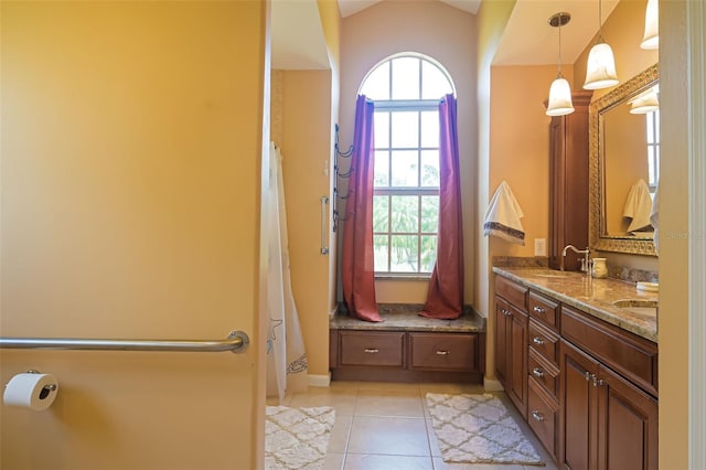 bathroom featuring tile patterned floors, plenty of natural light, and vanity