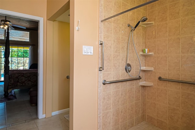 bathroom featuring ceiling fan, tile patterned floors, and a tile shower