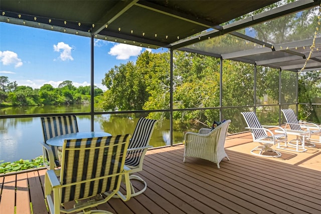 wooden deck featuring a water view