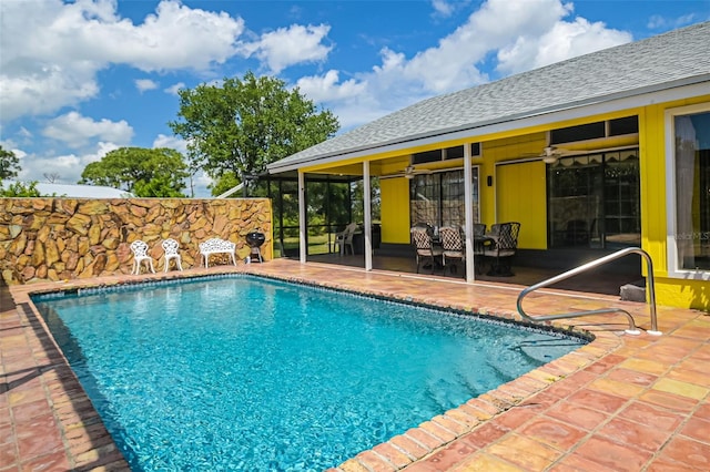 view of pool with a fenced in pool, a patio, and a ceiling fan