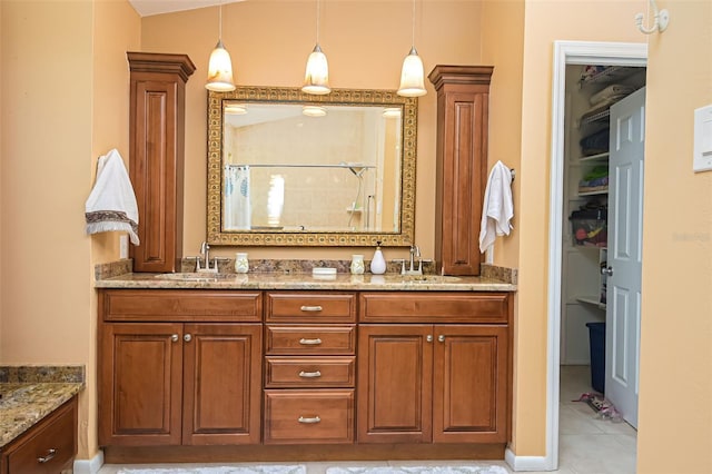 bathroom with vanity, vaulted ceiling, walk in shower, and tile patterned floors