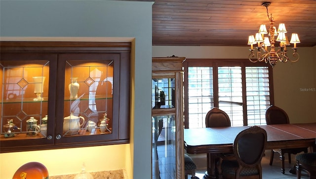 dining area with a notable chandelier and wooden ceiling