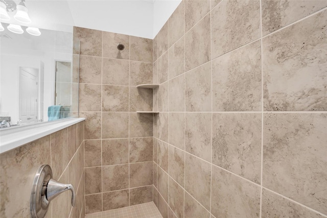 interior details with a tile shower