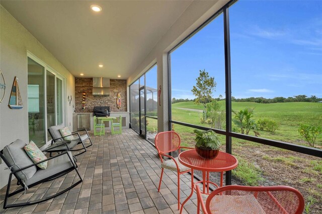 sunroom with a rural view