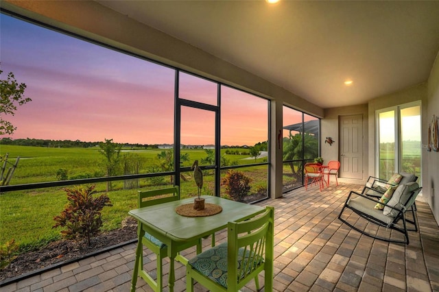 sunroom / solarium featuring a rural view