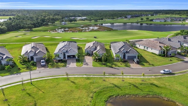 drone / aerial view with a water view, a residential view, and golf course view