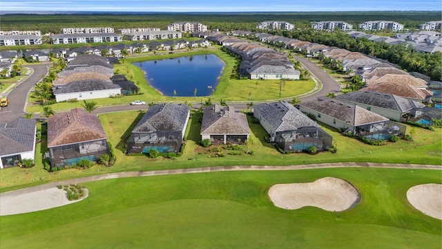 aerial view featuring a residential view, view of golf course, and a water view