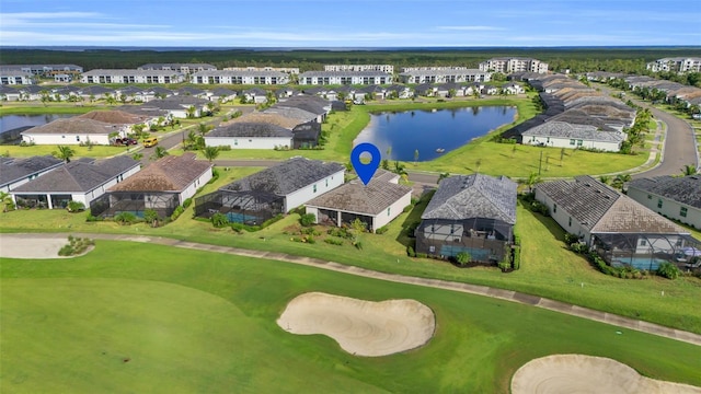 aerial view featuring a residential view, a water view, and golf course view