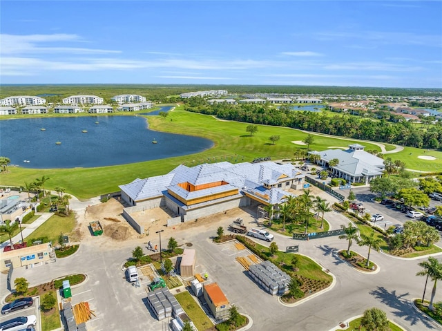 aerial view with view of golf course and a water view