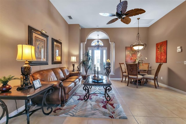 living room featuring ceiling fan and light tile patterned floors