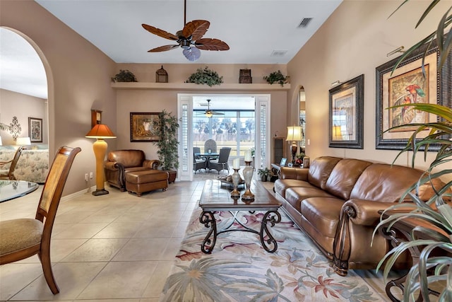 living room with ceiling fan and light tile patterned floors