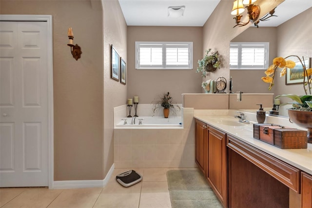 24588 Buckingham Way, Port Charlotte, FL 33980 - full bath with vanity, a bath, a healthy amount of sunlight, and tile patterned flooring