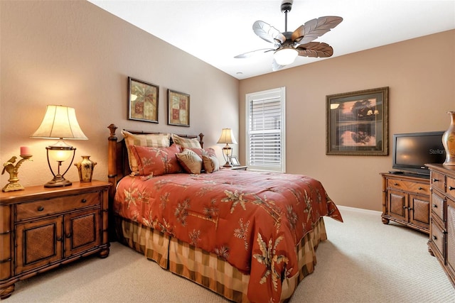 bedroom with light colored carpet and ceiling fan