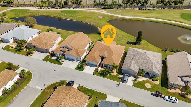 24588 Buckingham Way, Port Charlotte, FL 33980 - bird's eye view featuring golf course view, a residential view, and a water view