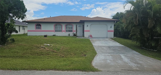 single story home featuring a garage and a front lawn